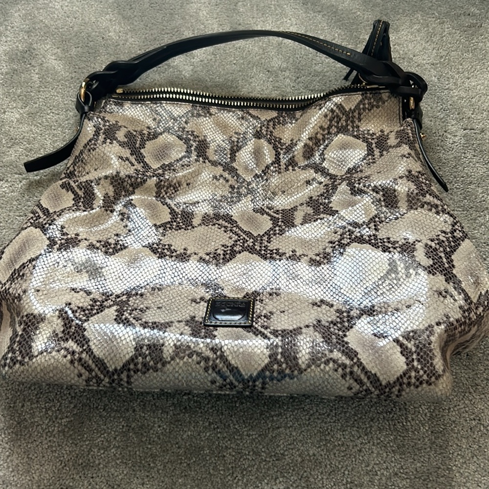 Dooney and bourke snake skin hand bag.